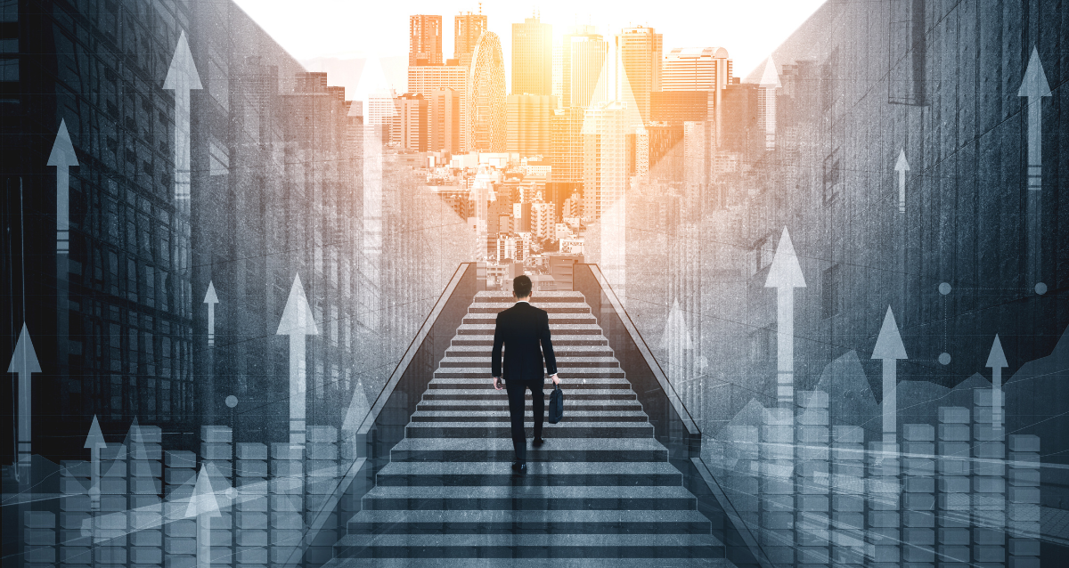 A man with a briefcase walking up a set of stairs surrounded by arrows pointing upwards with a city in the background. 