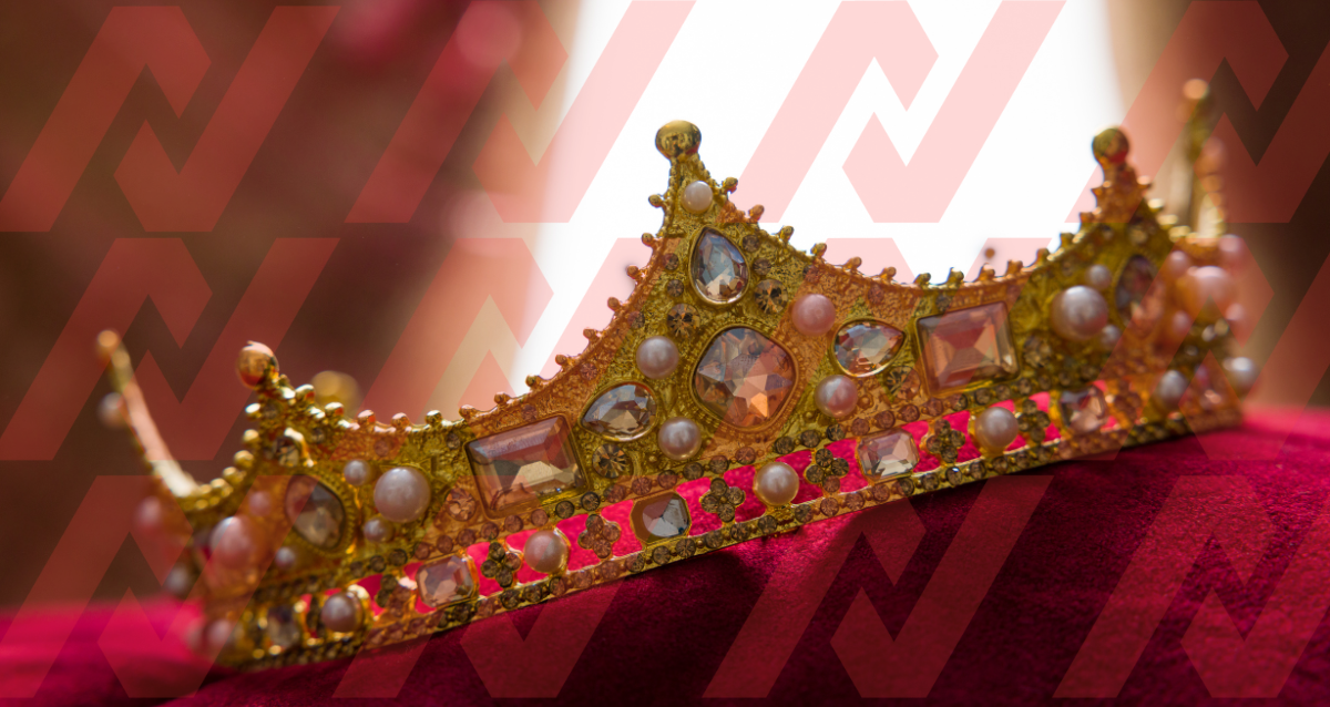 Photo of a crown leaning at an angle on red fabric